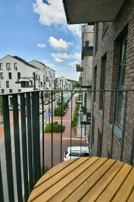 a balcony with a view of a city street at Stunning new flat in Old Town of Vilnius in Vilnius