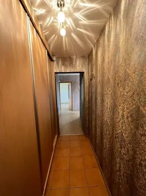 a hallway with a ceiling fan and a hallway with a hallwayngthngthngthngth at Spacious&cozy south apartment in Šiauliai
