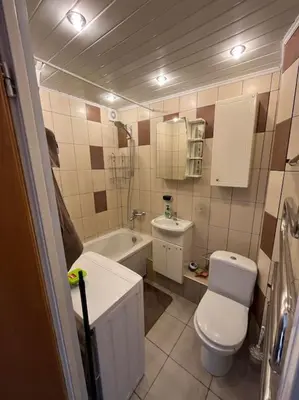 a small bathroom with a toilet and a sink at Spacious&cozy south apartment in Šiauliai
