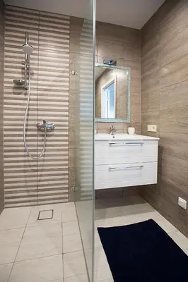 a bathroom with a sink and a shower at Vita apartment in Vilnius