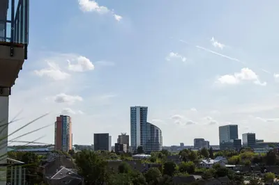 a view of a city skyline with tall buildings at Vita apartment in Vilnius