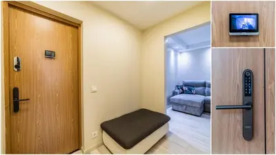 a room with a door and a room with a couch at Amber Apartments in Šiauliai