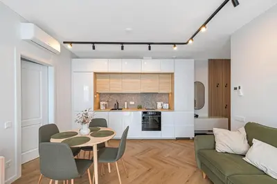 a living room with a table and a couch at Charming 1 BD Apartment by Domvia in Kaunas
