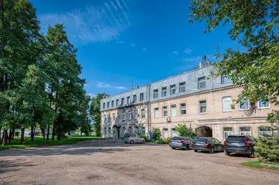 a large building with cars parked in front of it at Riverside 1 BD Central Apartment by Hostlovers in Kaunas