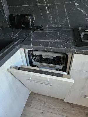 an open drawer in a kitchen with a counter top at Draugyste Apartment in Šiauliai