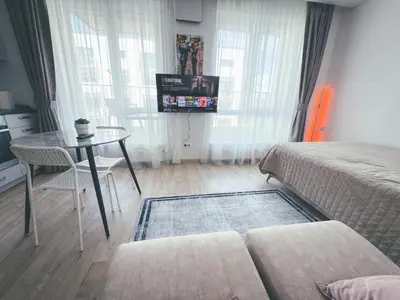 a small room with a table and a bed at Apartment with a large balcony in Kontverki