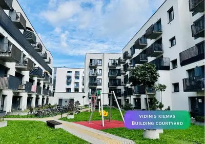 a building with a sign in front of it at Apartment with a large balcony in Kontverki