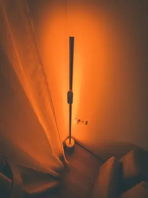 a lamp in the corner of a room with a curtain at Apartment with a large balcony in Kontverki