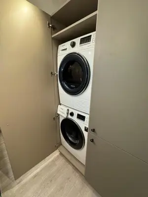 a washer and dryer in a small room at Charming & Central City Escape - Close to Transport in Vilnius