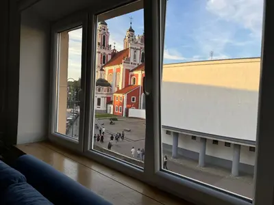 a view of a city from a window at Spacious apartment in Old Town Vilnius street in Vilnius