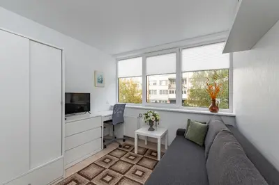 a living room with a couch and a desk at Pramones apartment #1 by PoloApartments in Kaunas