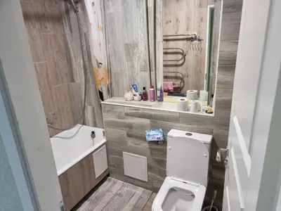 a bathroom with a white toilet and a sink at Kaunas 174 in Murava