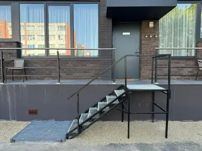a staircase on the side of a building at Chic Residence apartament 3 in Šiauliai