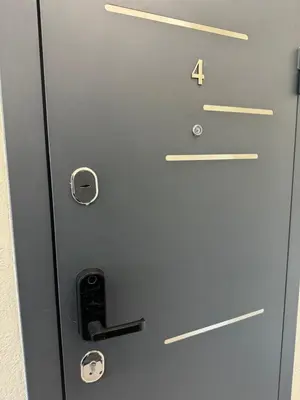 a metal door with the number four on it at Chic Residence apartament 4 in Šiauliai