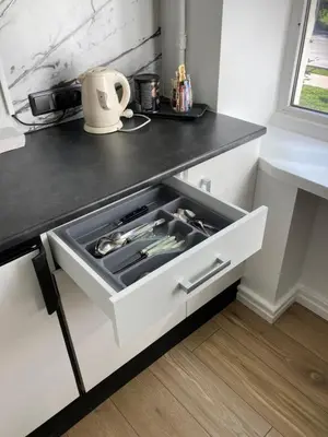 a drawer in a kitchen with a stove at White & Black in Šiauliai