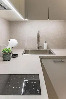 a kitchen counter with a sink and a sink at Loft G57 in Vilnius