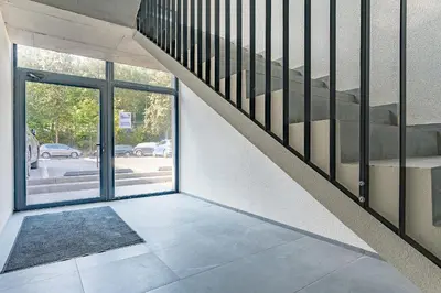 a staircase in a building with a glass door at Loft G57 in Vilnius