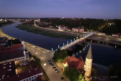 an aerial view of a city with a river and a bridge at Old Town - Bajor Studios - Self Check-in and Parking in Kaunas