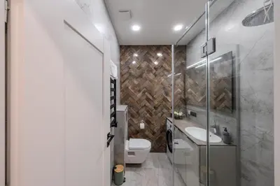 a bathroom with a toilet and a sink at Old Town - Bajor Studios - Self Check-in and Parking in Kaunas