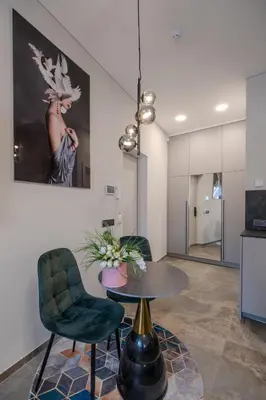 a meeting room with a table and two chairs at Old Town - Bajor Studios 2 - Self Check-in and Parking in Kaunas