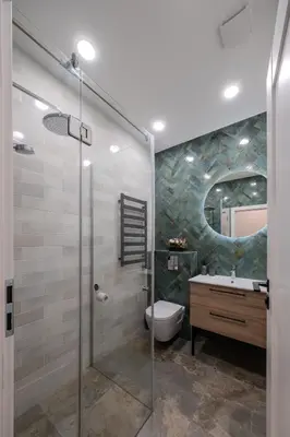 a bathroom with a shower and a toilet and a sink at Old Town - Bajor Studios 2 - Self Check-in and Parking in Kaunas