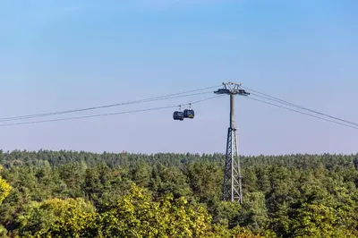 a ski lift in the middle of a forest at DRUSKININKŲ PANORAMA Apartamentai in Druskininkai