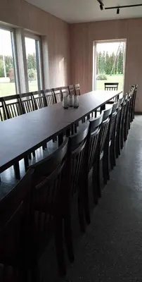 a large conference room with a long table and chairs at Sodyba Divaiva in Anykščiai