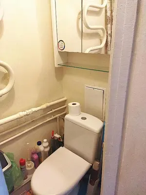 a bathroom with a toilet in a small room at Itaja apartment 49 in Šiauliai