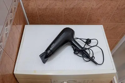 a black object sitting on top of a toilet at Central and Lovely Apartment in Vilnius Old Town by Reside Baltic in Vilnius
