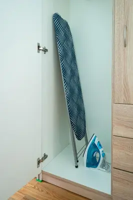 a surfboard leaning against a wall next to a door at Central and Lovely Apartment in Vilnius Old Town by Reside Baltic in Vilnius