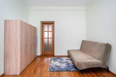 a living room with a couch and a door at Central and Lovely Apartment in Vilnius Old Town by Reside Baltic in Vilnius