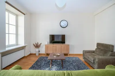 a living room with a couch and a table at Central and Lovely Apartment in Vilnius Old Town by Reside Baltic in Vilnius