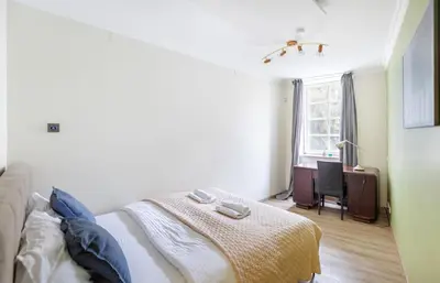 a bedroom with a bed and a window at Classic Apartments In The Prestigious Stikliu Str by Reside Baltic in Vilnius