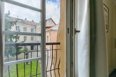 an open window with a view of a building at Classic Apartments In The Prestigious Stikliu Str by Reside Baltic in Vilnius