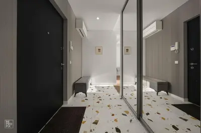 a hallway with two benches and a mirror at Bright 2BR with Private EV Parking, workspace, AC in Kaunas