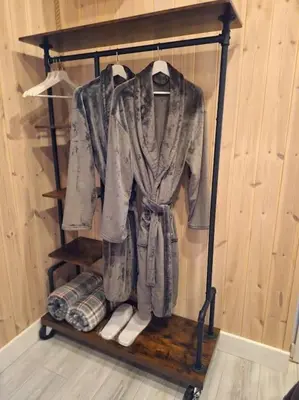 a shirt hanging on a shelf in a room at MiNi homes in Piniava