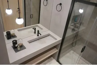 a white bathroom with a sink and a shower at HaPPy Inn Exclusive studio, Self check in, Parking in Vilnius
