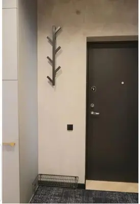 a black door with a sign on the side of a building at HaPPy Inn Exclusive studio, Self check in, Parking in Vilnius