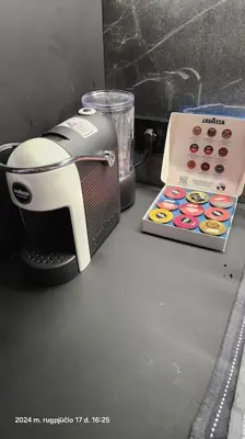 a coffee maker and a box on a counter at HaPPy Inn Exclusive studio, Self check in, Parking in Vilnius