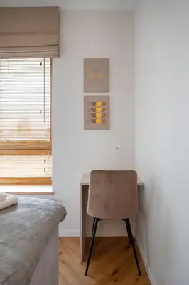 a bedroom with a desk and a chair at Stylish Simplicity - 1BDR Cozy Stay in Vilnius in Kontverki