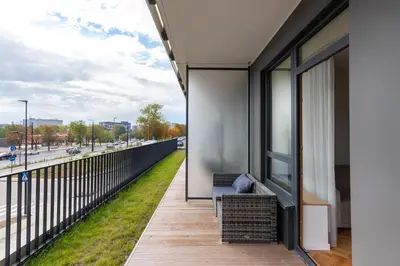 a balcony with a view of a street at Stylish Simplicity - 1BDR Cozy Stay in Vilnius in Kontverki