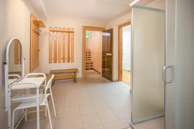 a room with a table and chairs and a door at Small House in Trakai Oldtown 1-6 sleeping places in Trakai