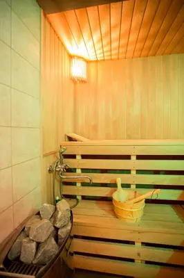 a sauna with a basket and a water hose at Small House in Trakai Oldtown 1-6 sleeping places in Trakai
