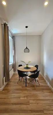 a dining room with a table and chairs at Bastion Apartment Old Town in Vilnius