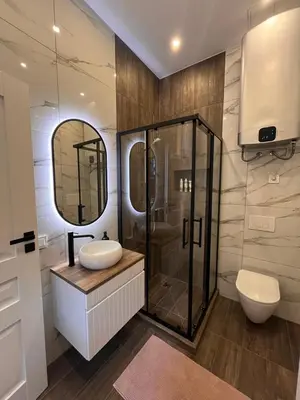 a bathroom with a sink and a shower at Bastion Apartment Old Town in Vilnius
