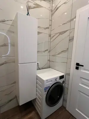 a laundry room with a washer and dryer at Bastion Apartment Old Town in Vilnius
