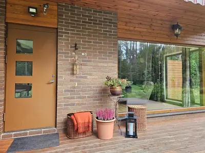 a front door of a house with a patio at Margirio namas in Birštonas