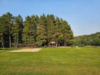 a park with a gazebo in the middle of a field at Vilos NEMUNO SLĖNIS namukai in Birštonas
