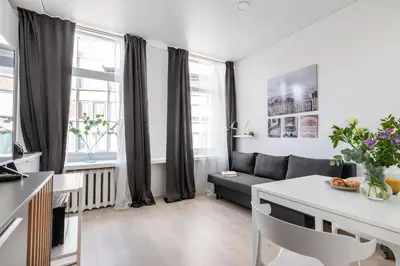 a living room with a couch and a table at The K1A Studio Collective in Vilnius
