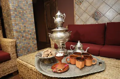 a tray with cups and a trophy on a table at Argo Trakai in Trakai